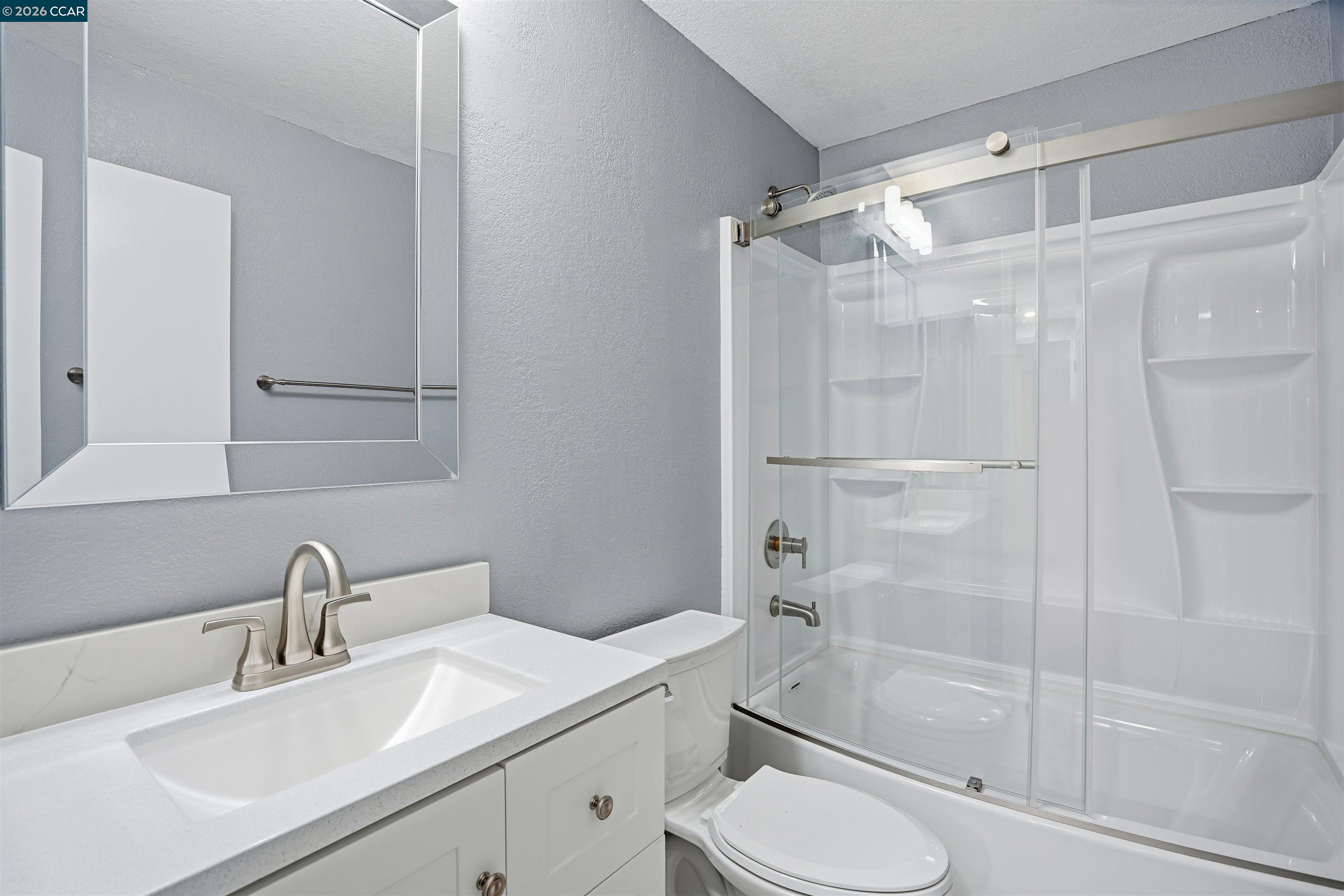 834 Coral Ridge Circle Rodeo, CA 94572 - Photo 21 of 32 a bathroom with a sink toilet and shower