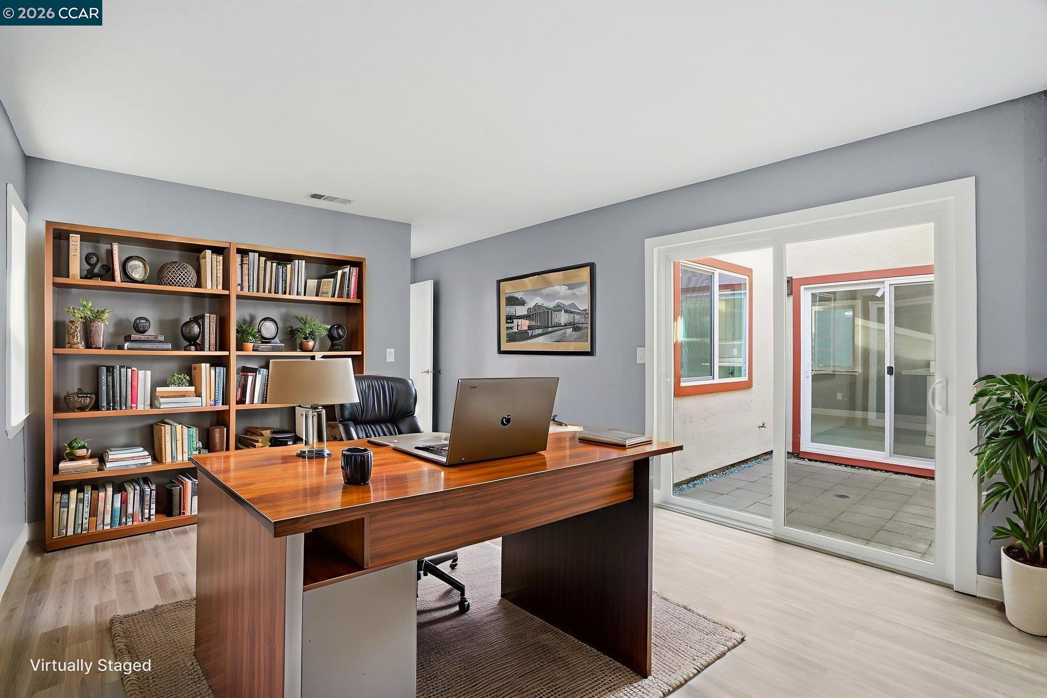 834 Coral Ridge Circle Rodeo, CA 94572 - Photo 24 of 32 a view of a workspace with a bookshelf