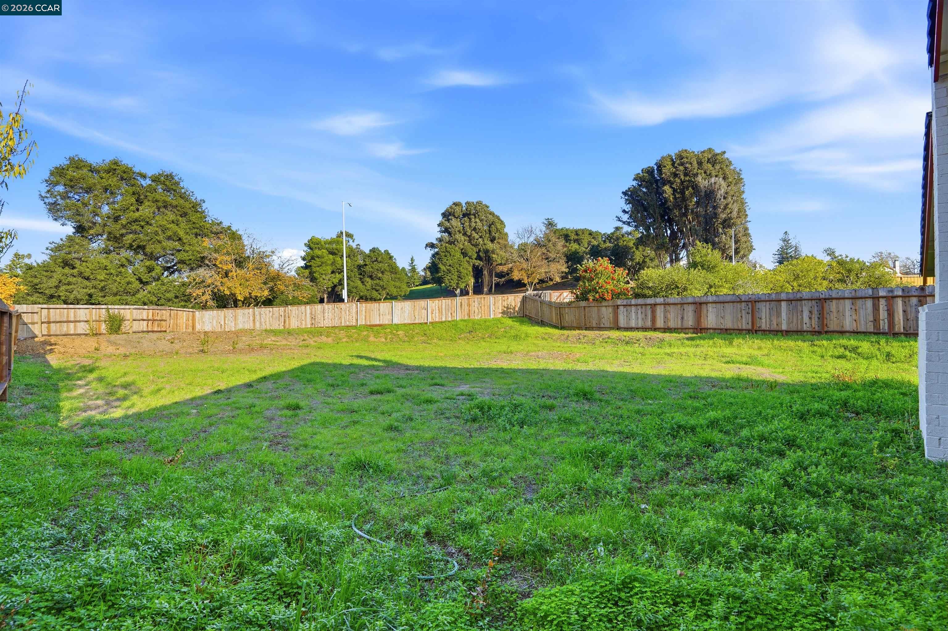 834 Coral Ridge Circle Rodeo, CA 94572 - Photo 30 of 32 a view of a swimming pool with a yard