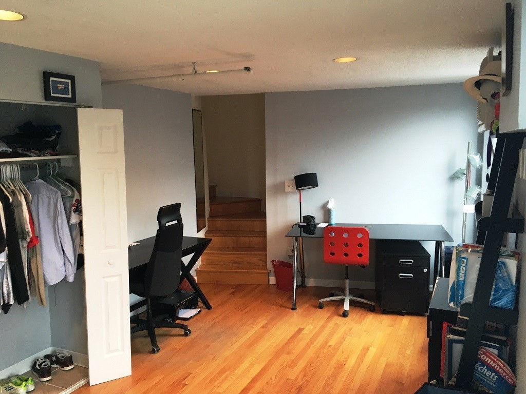 12 Stoneholm Street, Unit 520 Boston, MA 02115 - Photo 15 of 27 a living room with furniture and a flat screen tv