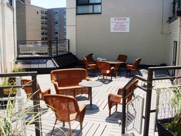 12 Stoneholm Street, Unit 520 Boston, MA 02115 - Photo 18 of 27 a patio with table and chairs
