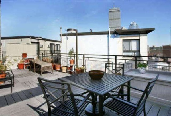 12 Stoneholm Street, Unit 520 Boston, MA 02115 - Photo 20 of 27 a view of a dining table and chairs in the patio