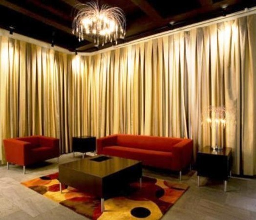 12 Stoneholm Street, Unit 520 Boston, MA 02115 - Photo 21 of 27 a room with a bed and a chandelier