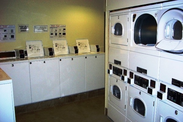 12 Stoneholm Street, Unit 520 Boston, MA 02115 - Photo 22 of 27 a utility room with dryer and washer