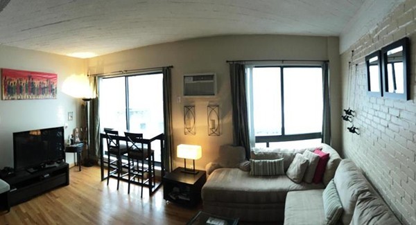 12 Stoneholm Street, Unit 520 Boston, MA 02115 - Photo 9 of 27 a bedroom with furniture and a flat screen tv