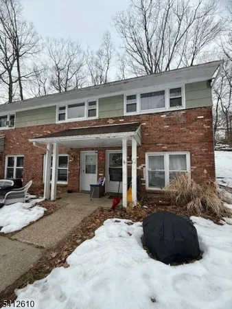 a front view of a house with a patio