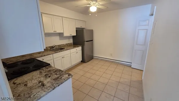 a kitchen with a stove and a refrigerator
