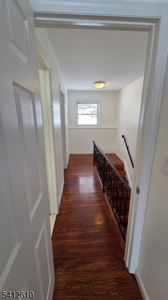 12 Ghost Pony Road, Unit B Andover, NJ 07821 - Photo 4 of 10 a view of a hallway with wooden floor and stairs