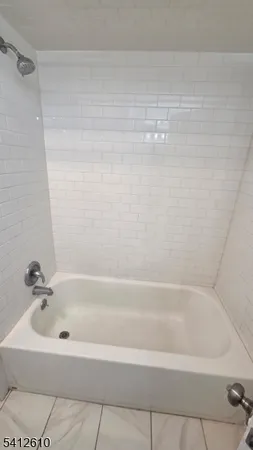 a bathroom with bathtub