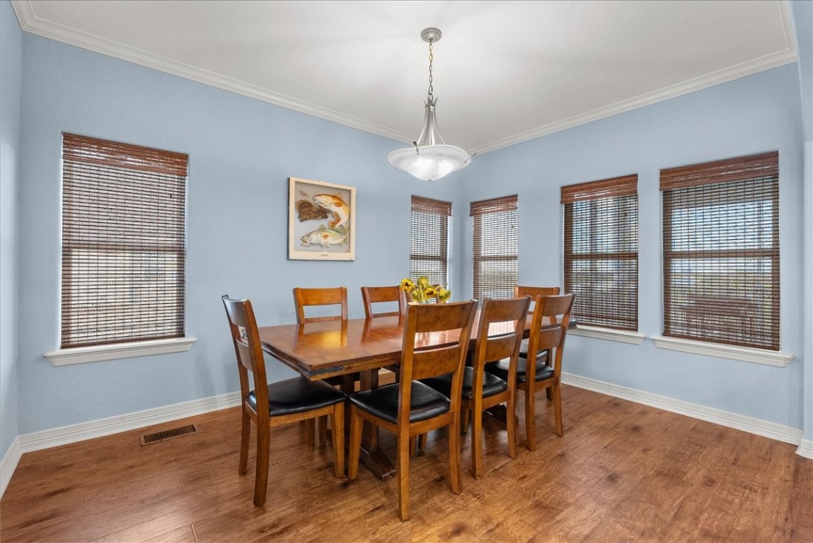 211 Tuna Run Freeport, TX 77541 - Photo 21 of 48 Dining area opens to the living area and kitchen, creating a seamless flow ideal for entertaining.