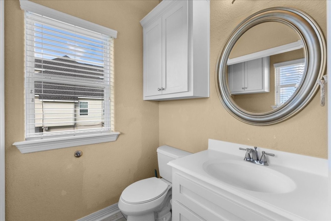 211 Tuna Run Freeport, TX 77541 - Photo 24 of 48 This half bath, laundry room combo is just off the kitchen.