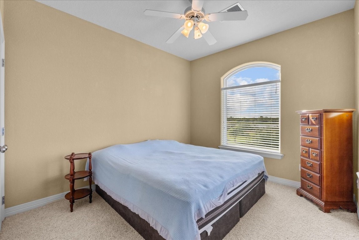 211 Tuna Run Freeport, TX 77541 - Photo 32 of 48 Bedroom 2 is upstairs with a large closet and access to a shared, connected bathroom.