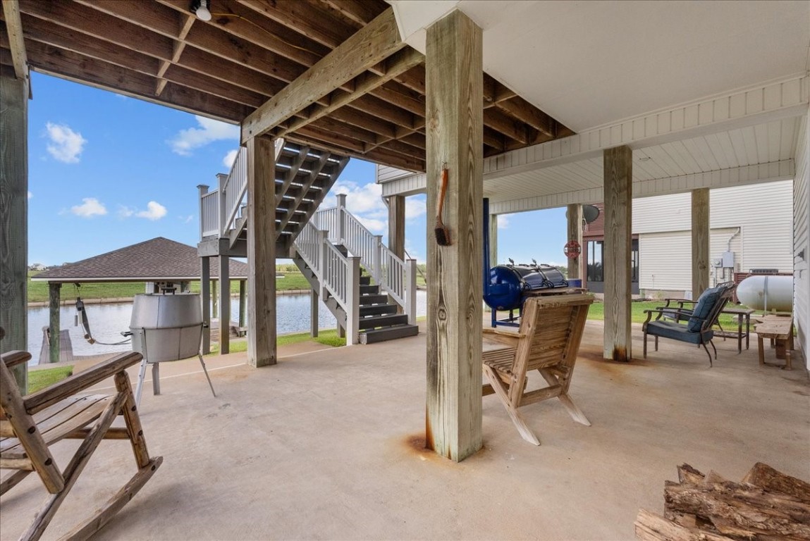 211 Tuna Run Freeport, TX 77541 - Photo 43 of 48 Catch the coastal breezes out of the heat of the sun from the ground floor deck. Perfect for relaxing and entertaining.