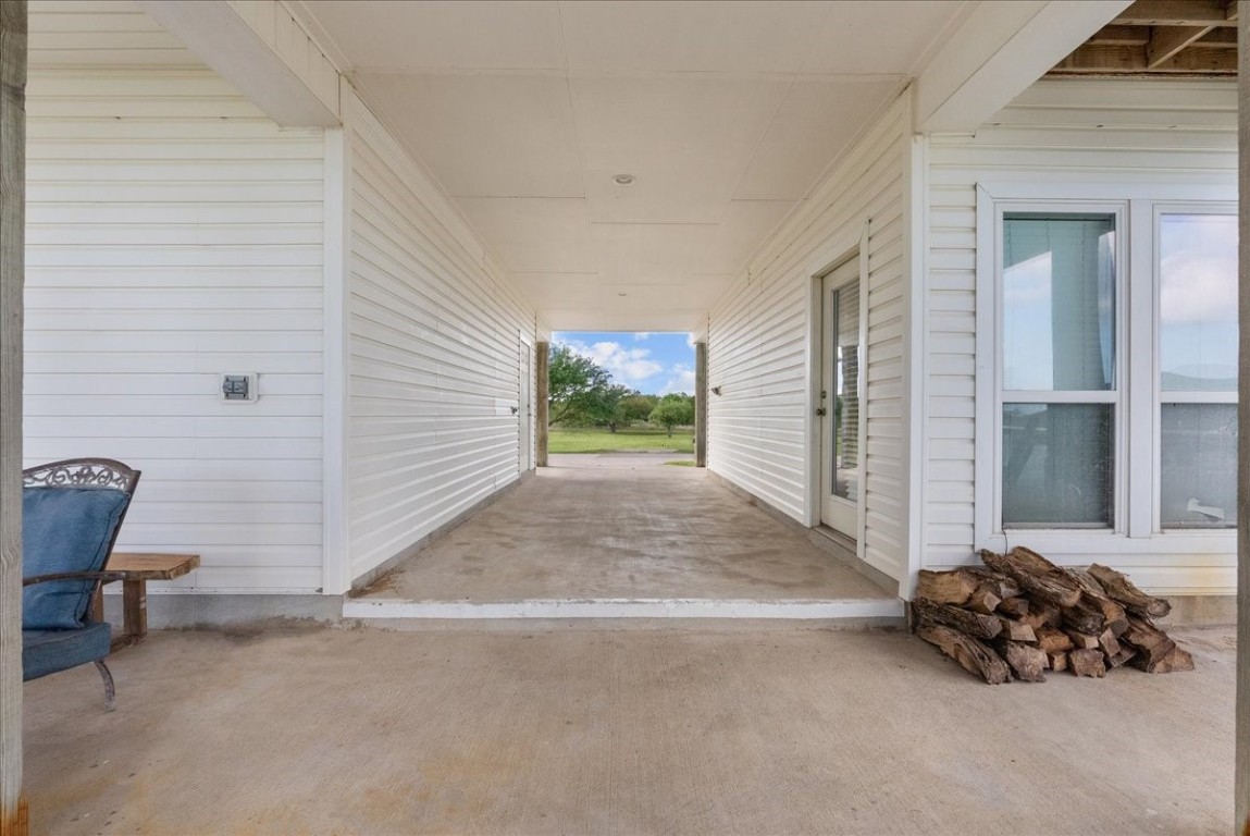 211 Tuna Run Freeport, TX 77541 - Photo 45 of 48 Covered breezeway between the garage and guest quarters.