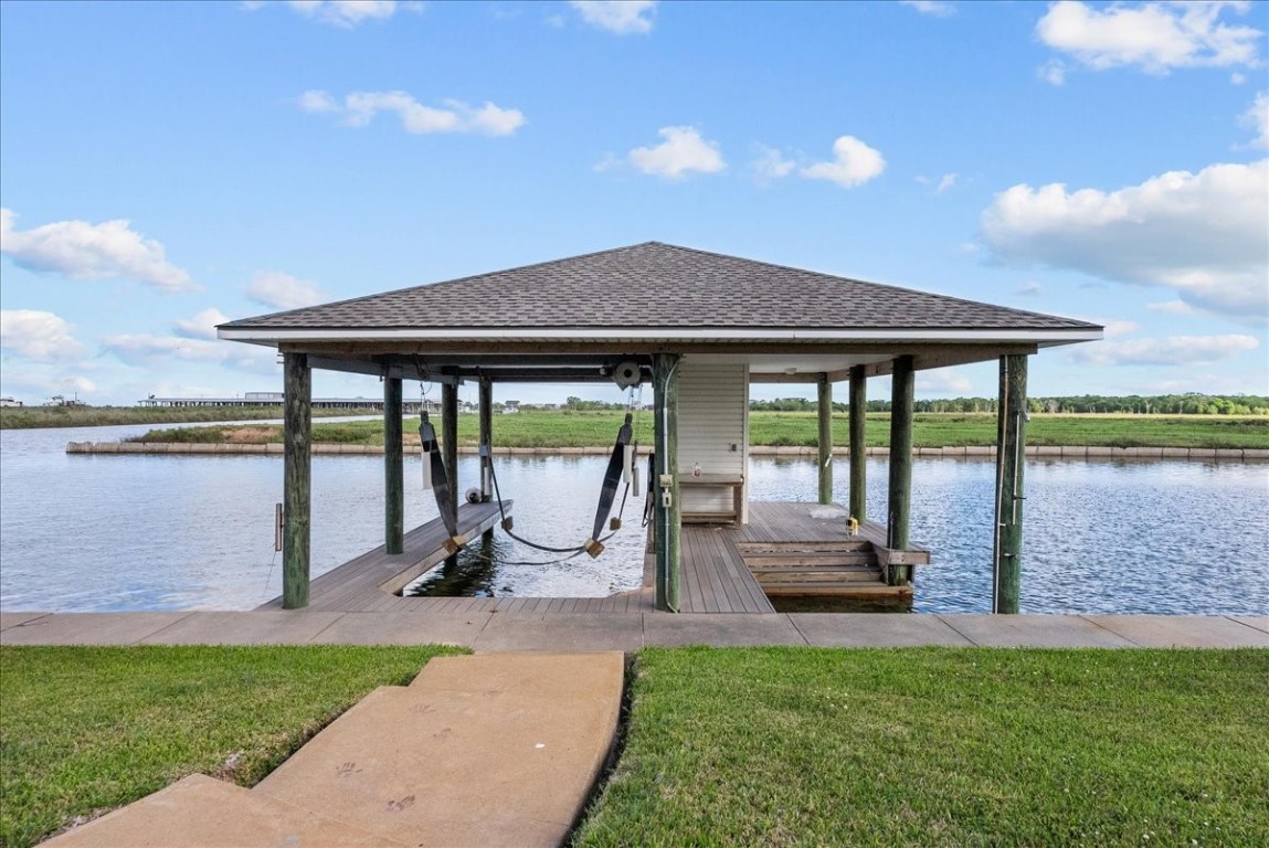 211 Tuna Run Freeport, TX 77541 - Photo 46 of 48 This boat house has it all! Boat lift, room for jet skis, storage and a fish cleaning station.