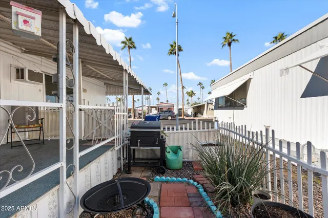 a view of a balcony with furniture