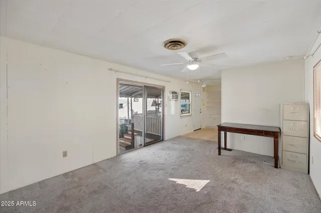 a view of an empty room with a window