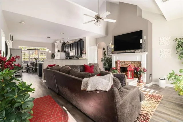 a living room with furniture fireplace and flat screen tv