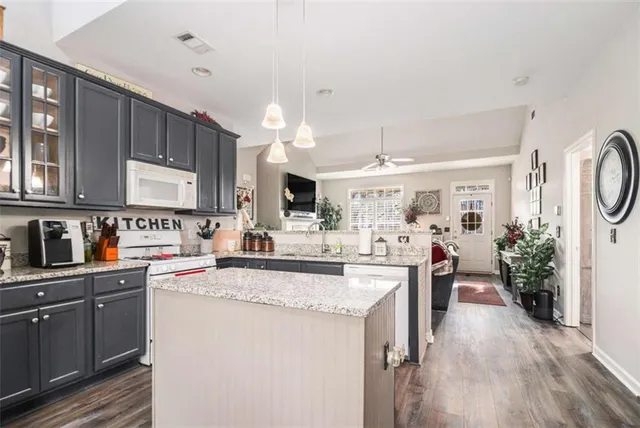 a kitchen with sink cabinets and window