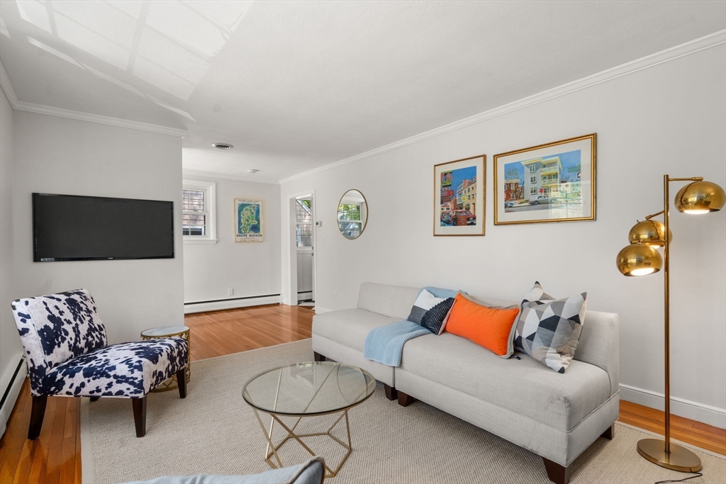 44 Hackensack Road Chestnut Hill, MA 02467 - Photo 3 of 13 a living room with furniture and a flat screen tv