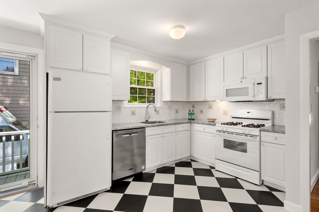 44 Hackensack Road Chestnut Hill, MA 02467 - Photo 6 of 13 a kitchen with stainless steel appliances a stove a sink and a refrigerator