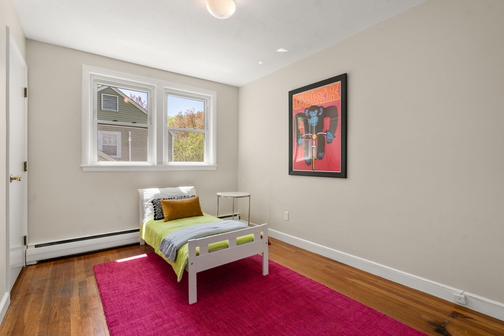 44 Hackensack Road Chestnut Hill, MA 02467 - Photo 7 of 13 a bedroom with a bed and wooden floor