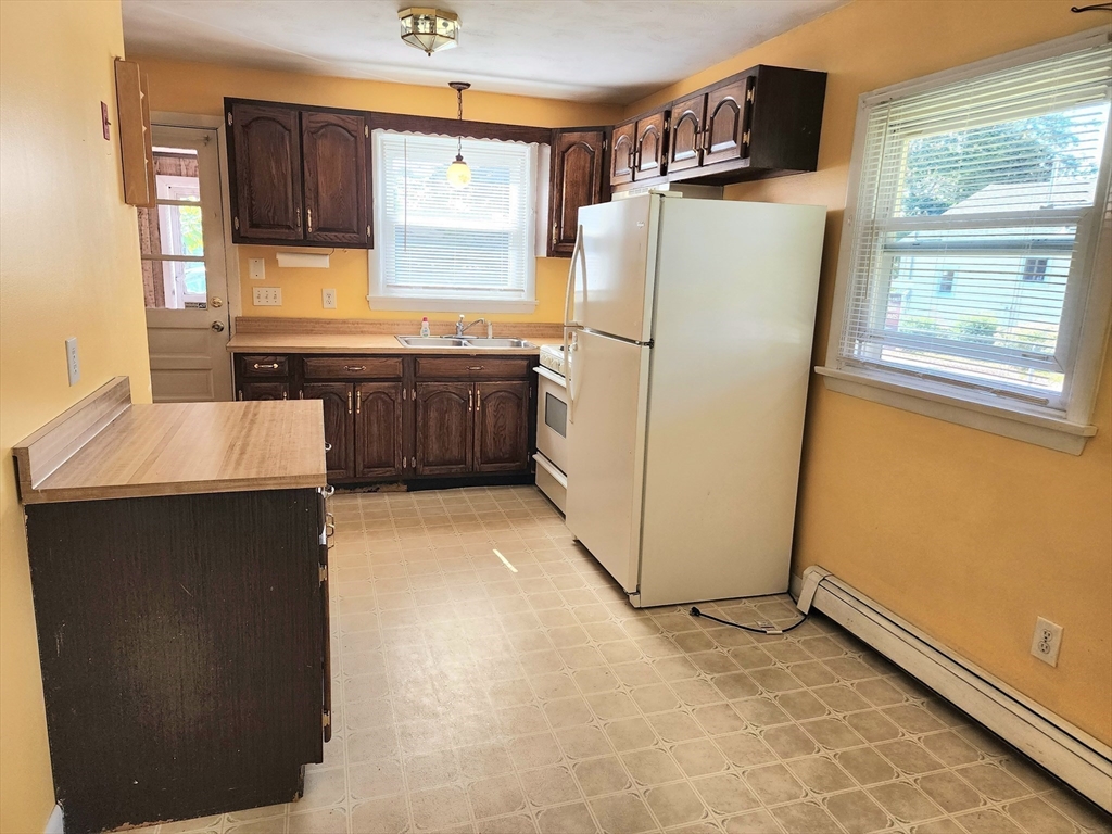 37 Old Onset Road Onset, MA 02558 - Photo 5 of 20 a kitchen with refrigerator and cabinets
