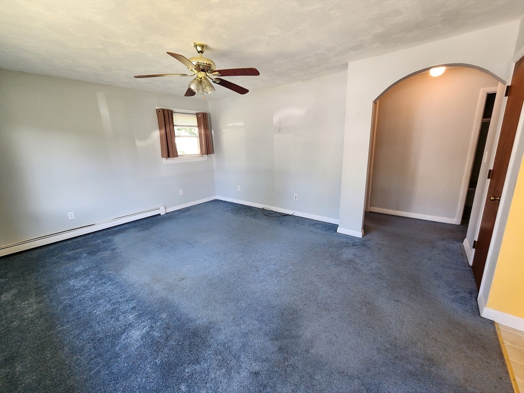 37 Old Onset Road Onset, MA 02558 - Photo 7 of 20 an empty room with windows and fan