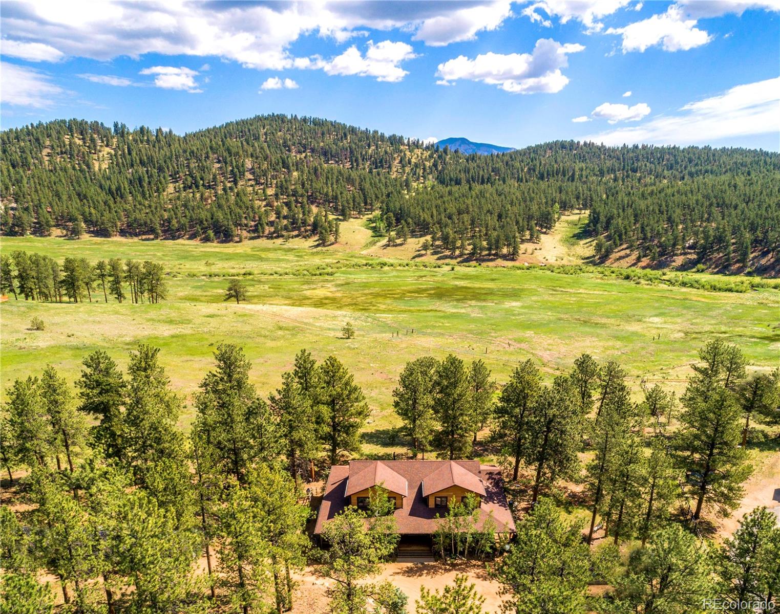 503 Conestoga Road Bailey, CO 80421 - Photo 1 of 40 a view of a city with an ocean beach