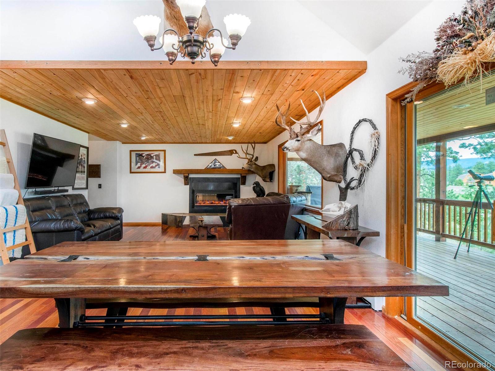 503 Conestoga Road Bailey, CO 80421 - Photo 13 of 40 a view of a room with furniture and wooden floor