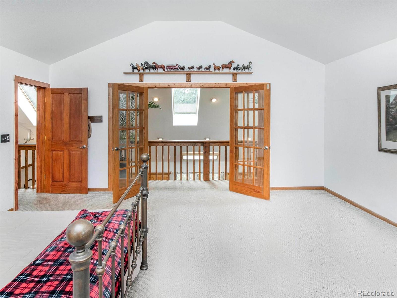 503 Conestoga Road Bailey, CO 80421 - Photo 23 of 40 a view of a bedroom with furniture and staircase