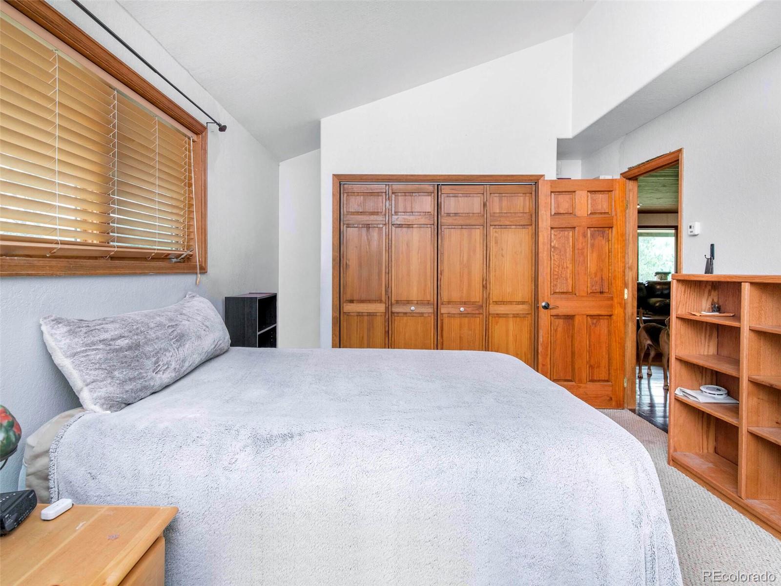 503 Conestoga Road Bailey, CO 80421 - Photo 29 of 40 a bedroom with a bed and a window