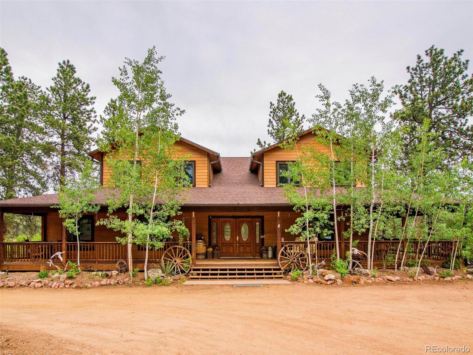 503 Conestoga Road Bailey, CO 80421 - Photo 3 of 40 a front view of a building with streets and trees