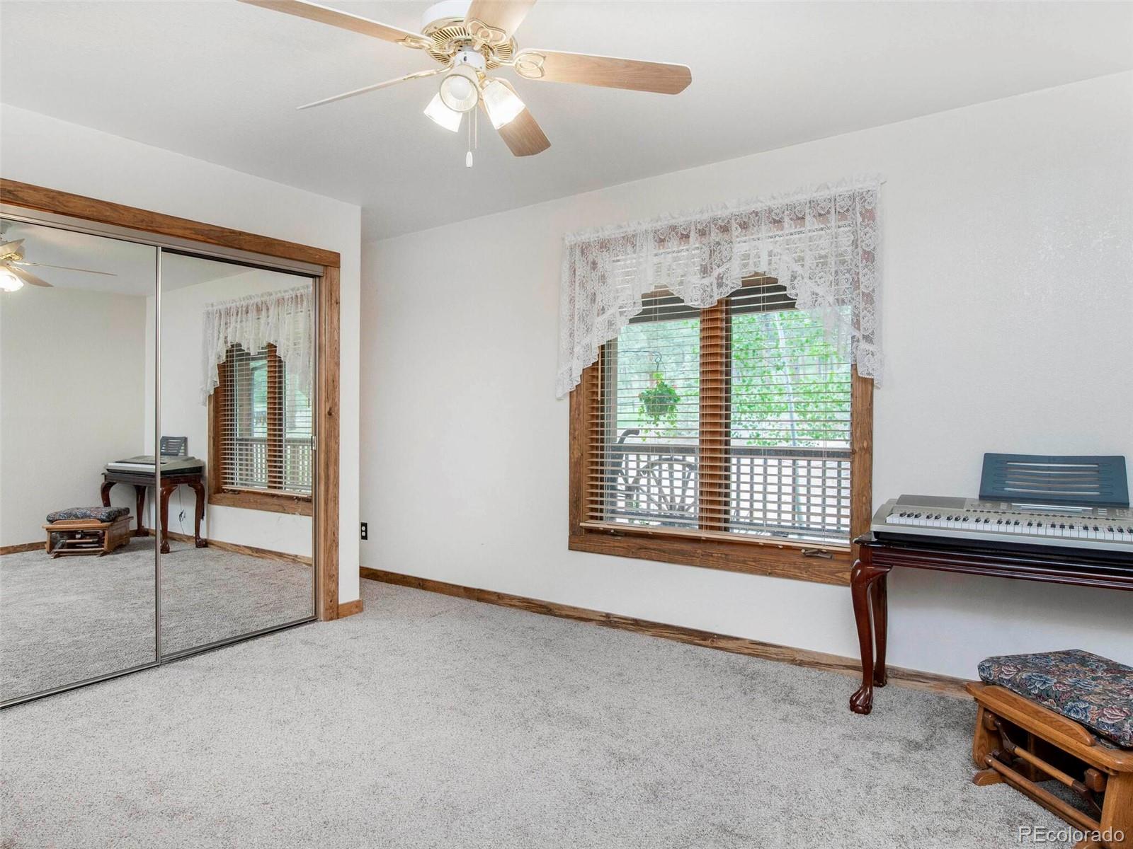 503 Conestoga Road Bailey, CO 80421 - Photo 31 of 40 a livingroom with furniture and a window