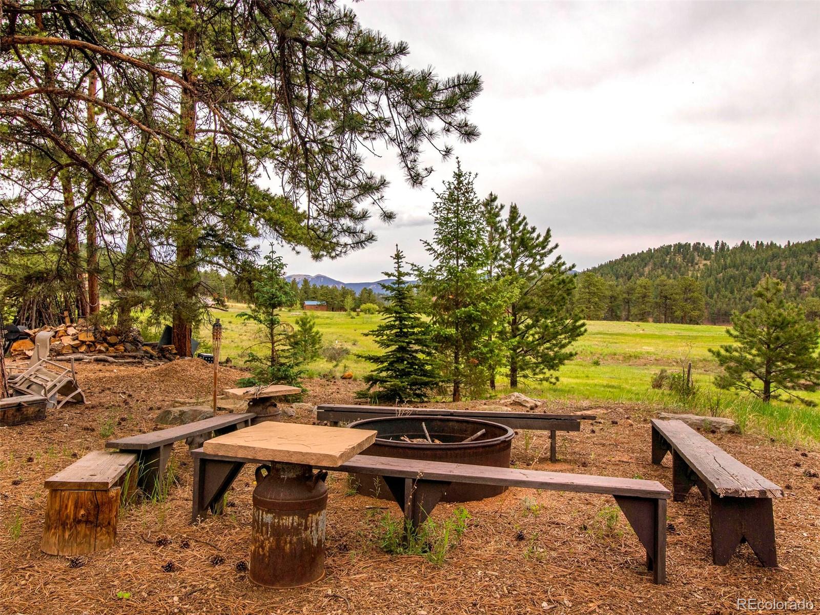 503 Conestoga Road Bailey, CO 80421 - Photo 34 of 40 a view of a terrace with chairs