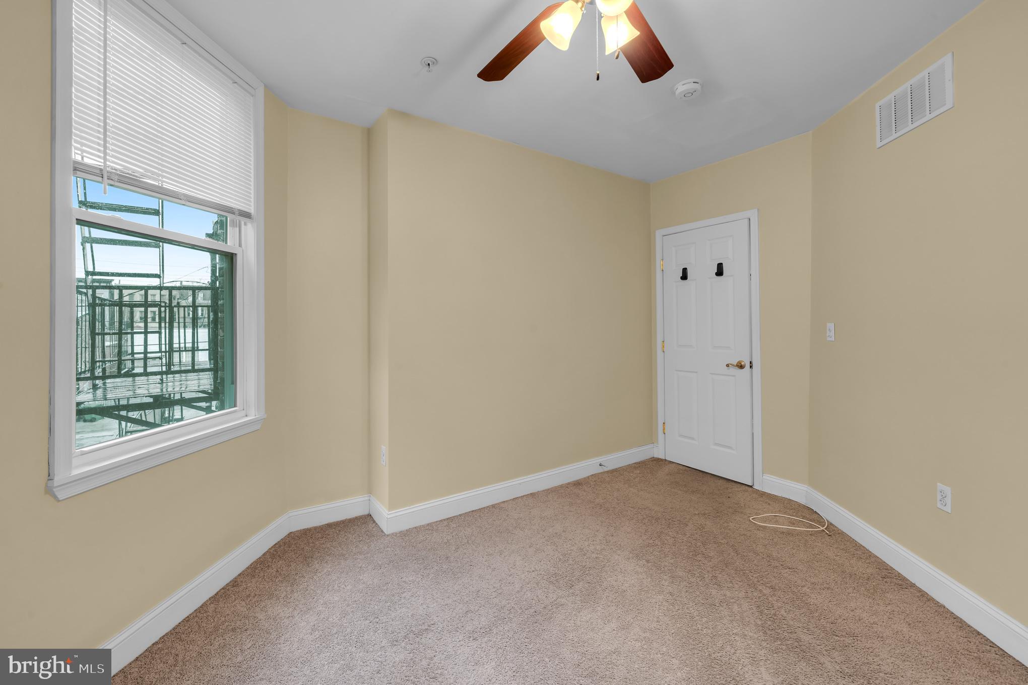 2210 North Charles Street Baltimore, MD 21218 - Photo 14 of 31 a view of an empty room with a window