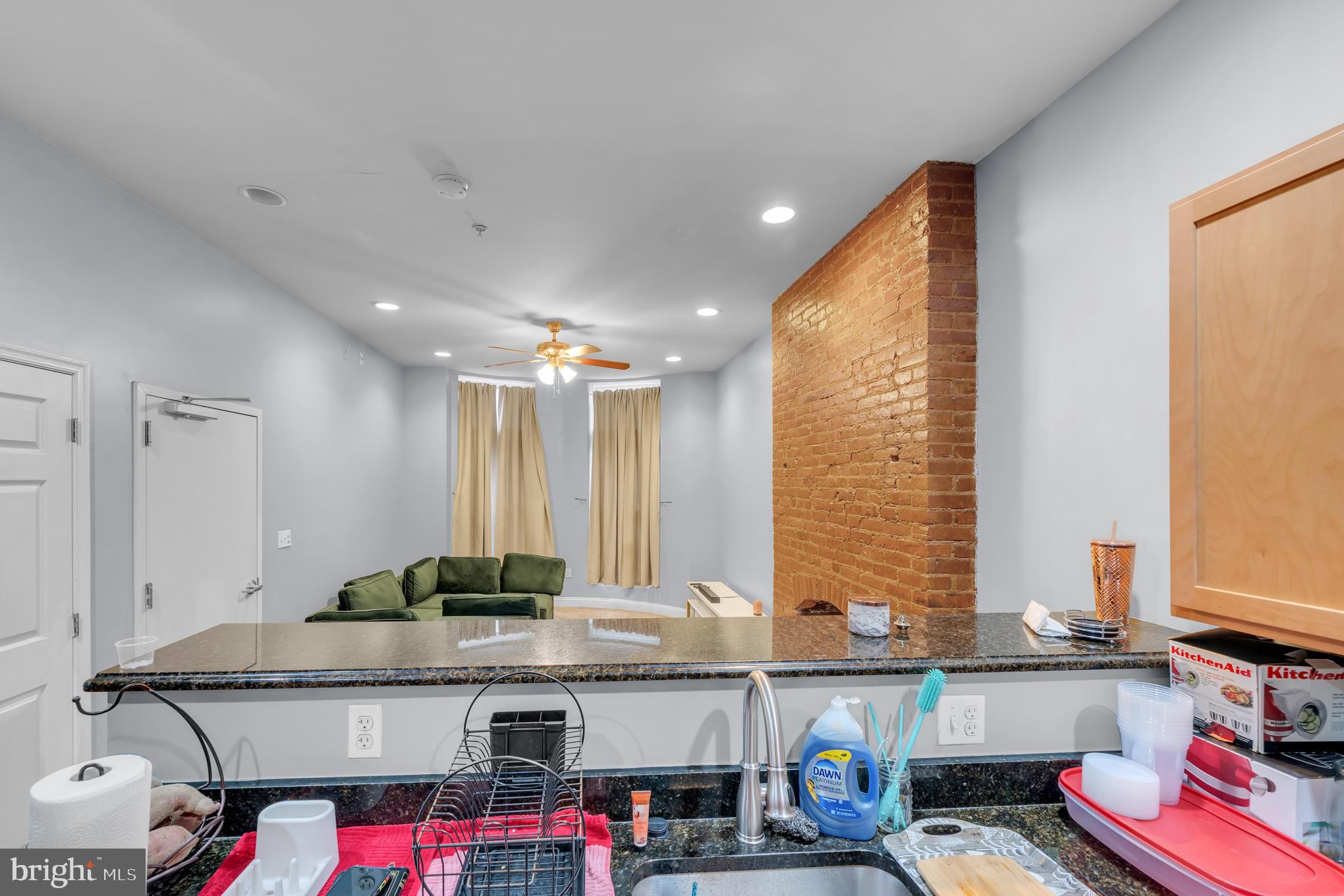 2210 North Charles Street Baltimore, MD 21218 - Photo 23 of 31 a room with furniture a flat screen tv and a window