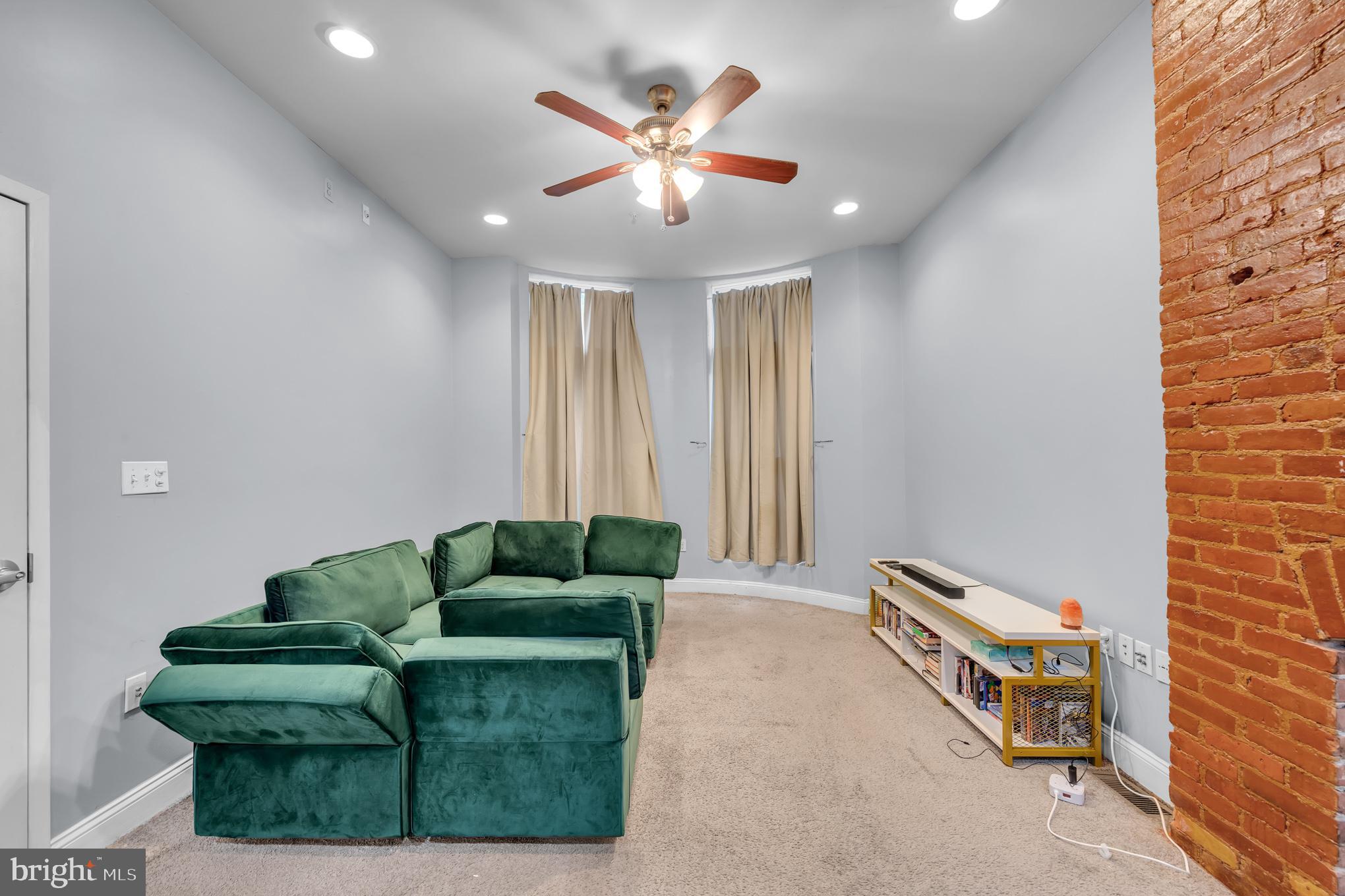 2210 North Charles Street Baltimore, MD 21218 - Photo 27 of 31 a living room with furniture and a ceiling fan