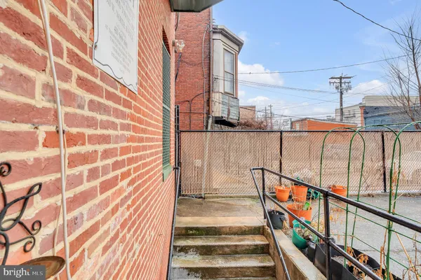 a view of a balcony with wooden floor and staircase