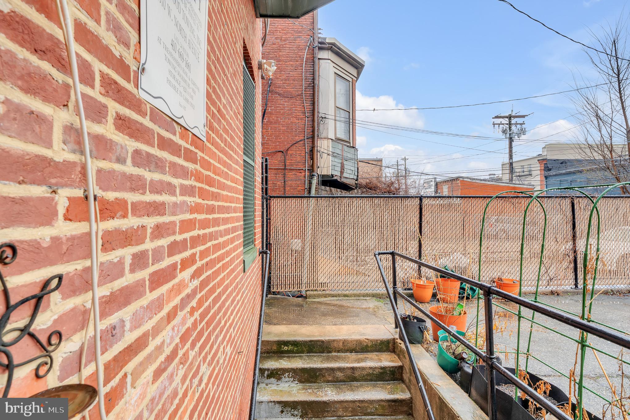2210 North Charles Street Baltimore, MD 21218 - Photo 31 of 31 a view of a balcony with wooden floor and staircase
