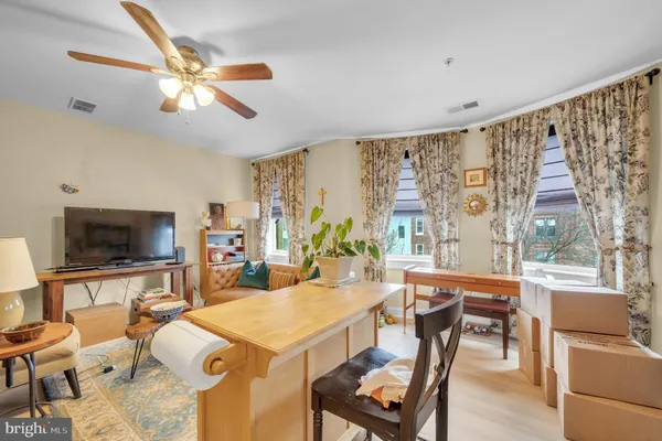 a view of a livingroom with furniture window and wooden floor