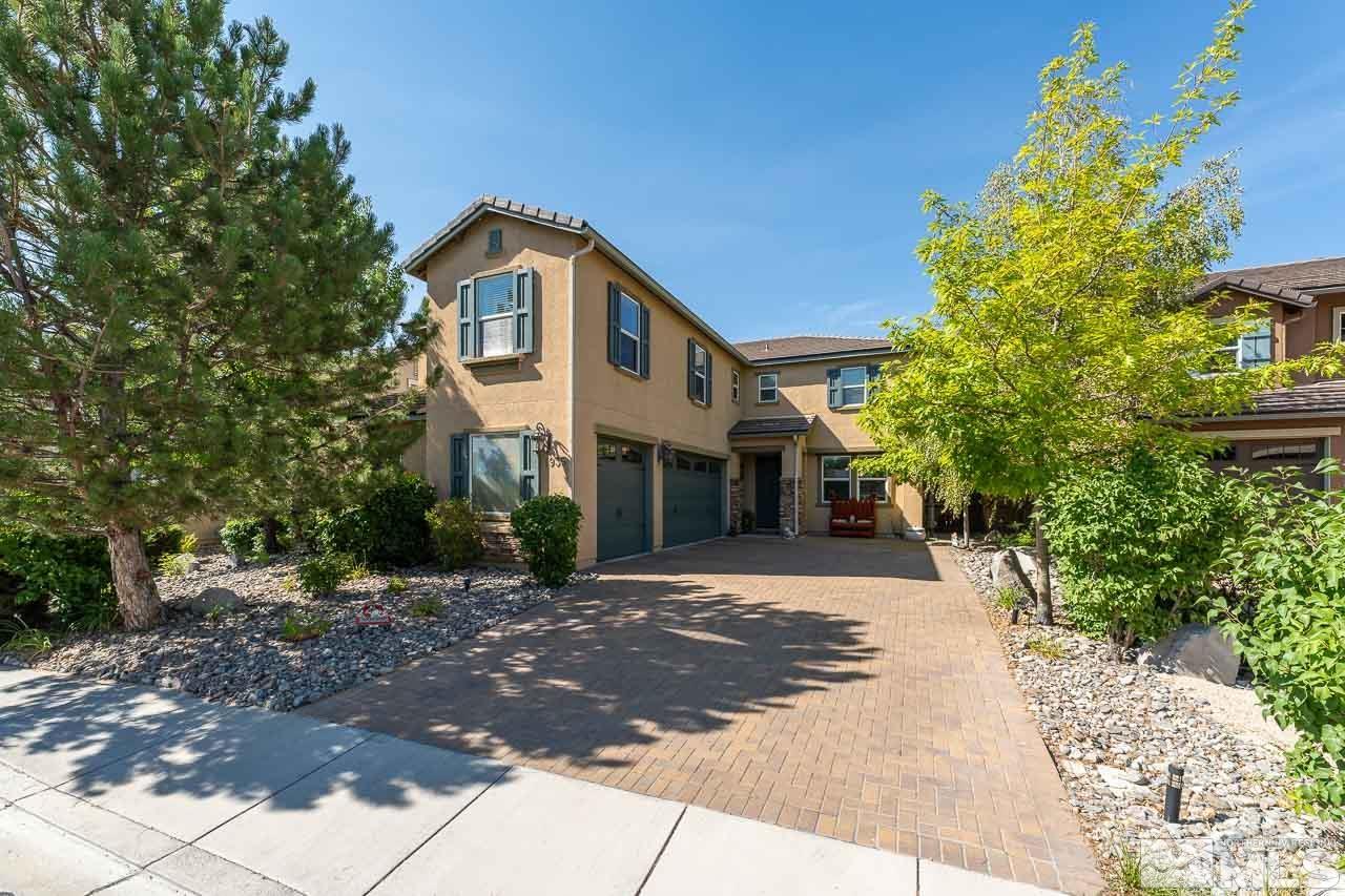 1935 Angel Ridge Drive Reno, NV 89521 - Photo 17 of 33 a front view of a house with a yard and a garage