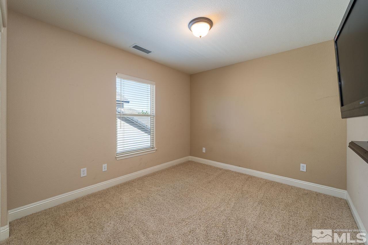 1935 Angel Ridge Drive Reno, NV 89521 - Photo 22 of 33 an empty room with a window