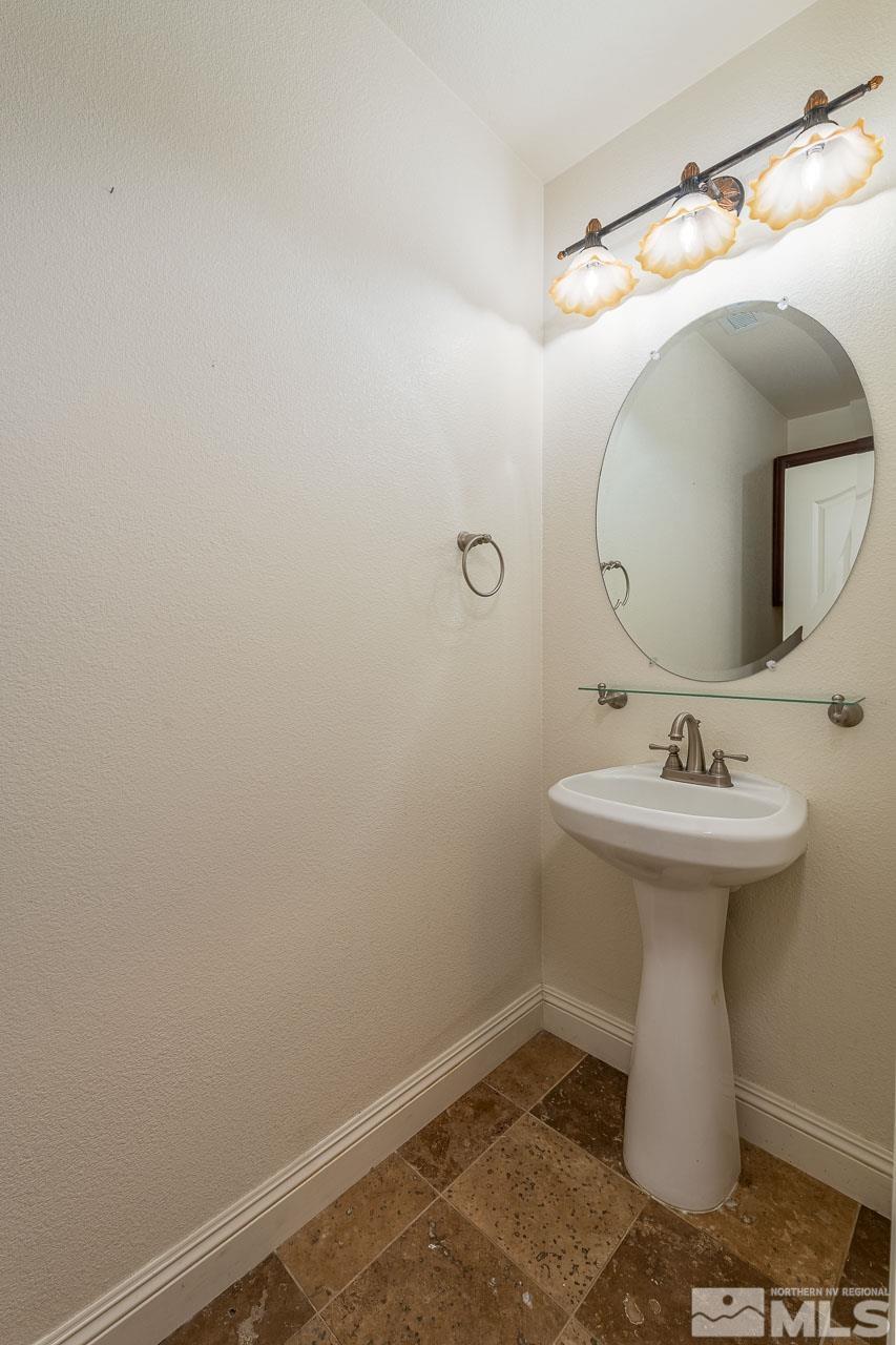 1935 Angel Ridge Drive Reno, NV 89521 - Photo 27 of 33 a bathroom with a sink and mirror