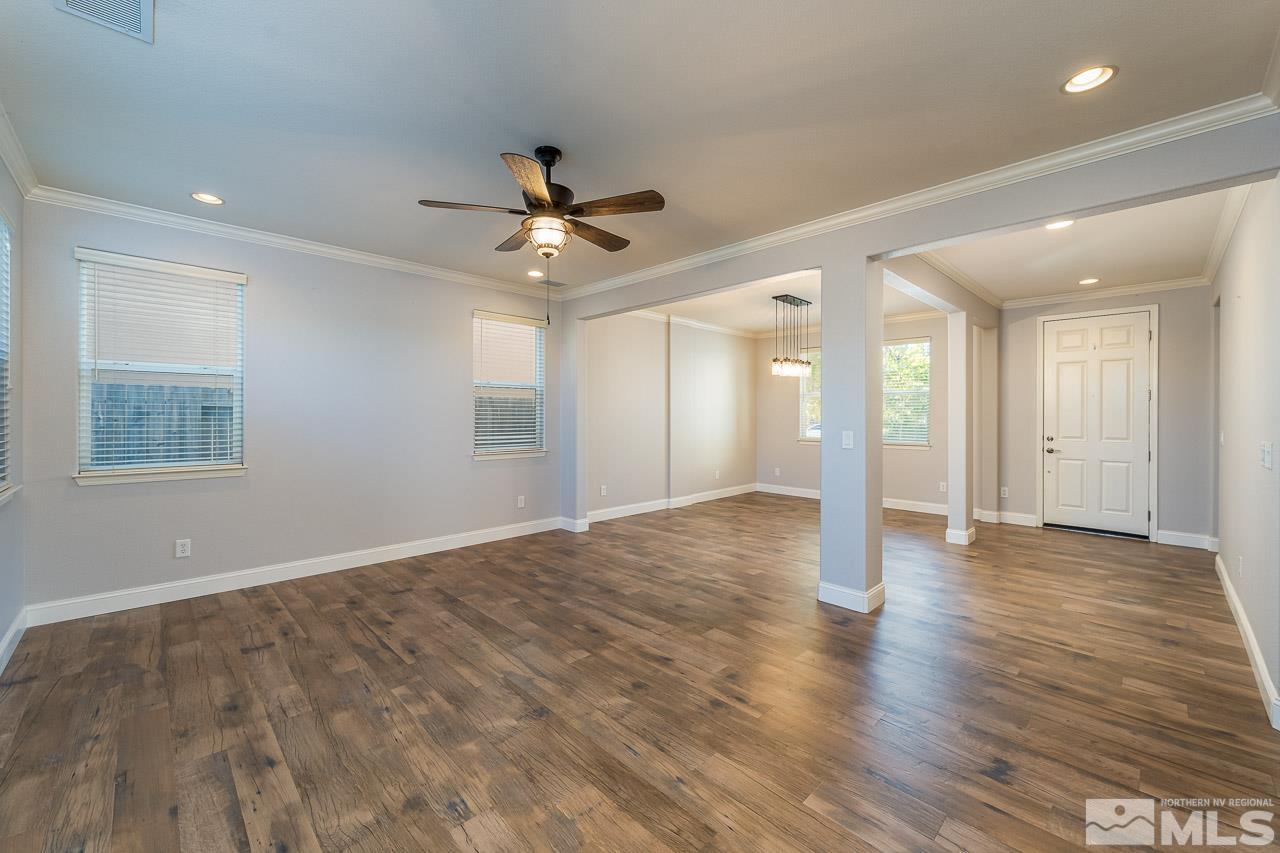 1935 Angel Ridge Drive Reno, NV 89521 - Photo 9 of 33 a view of an empty room with a window and wooden floor