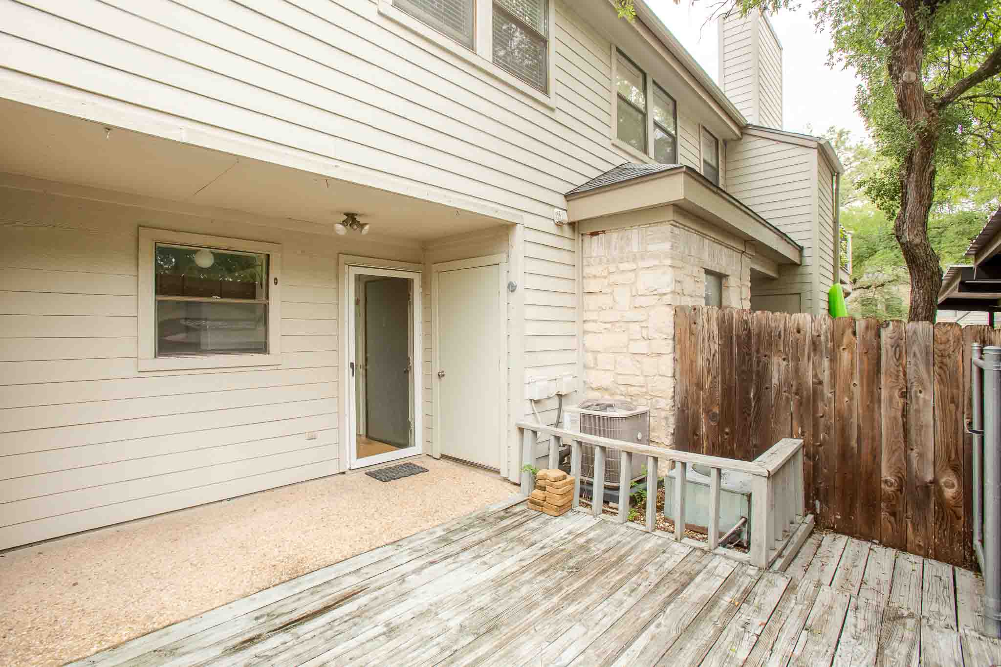 9226 Jollyville Road, Unit 132 Austin, TX 78759 - Photo 14 of 15 A private outdoor patio with wood decking awaits for peaceful relaxation.