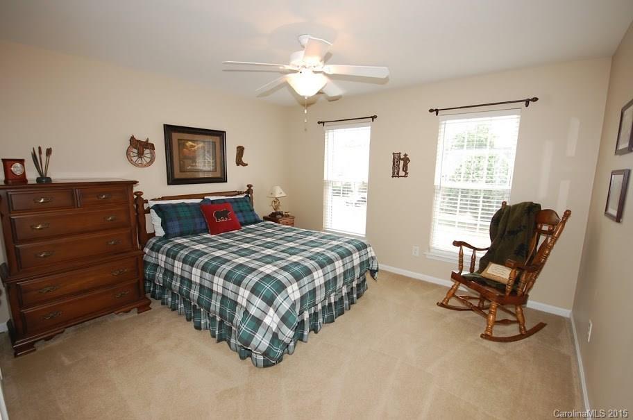 2361 Harvester Avenue, Unit 137 Fort Mill, SC 29708 - Photo 14 of 24 a bedroom with a bed desk and chair