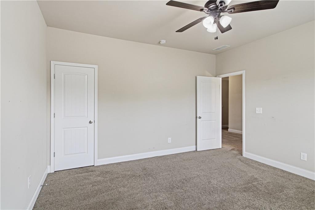 114 Madison Street Canton, GA 30115 - Photo 25 of 39 a view of a livingroom with a ceiling fan