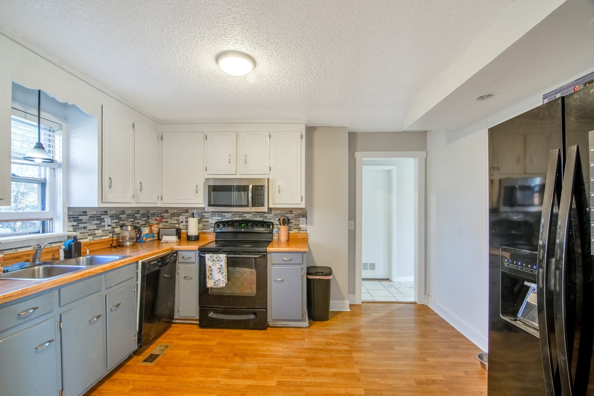12252 Karo Road Bell Buckle, TN 37020 - Photo 3 of 25 a kitchen with stainless steel appliances granite countertop a refrigerator and a stove top oven