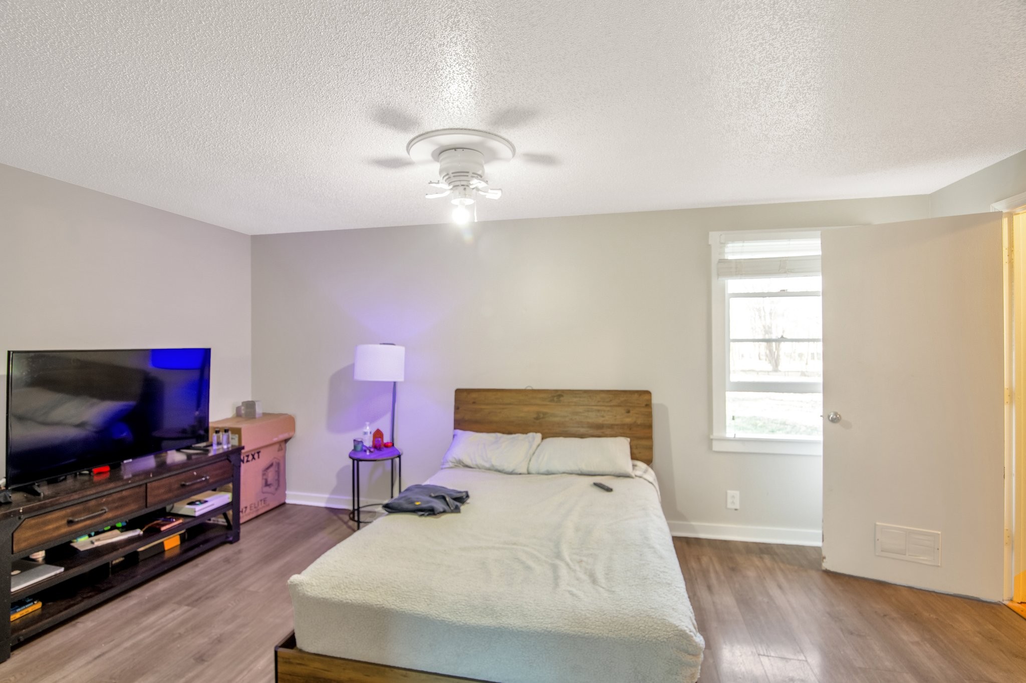 12252 Karo Road Bell Buckle, TN 37020 - Photo 8 of 25 a bedroom with a bed and a flat screen tv